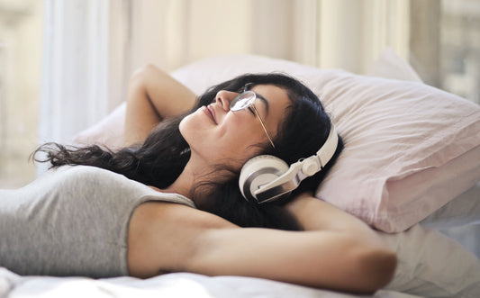 selfcare, meditation, relaxation, laying in bed, listening to music