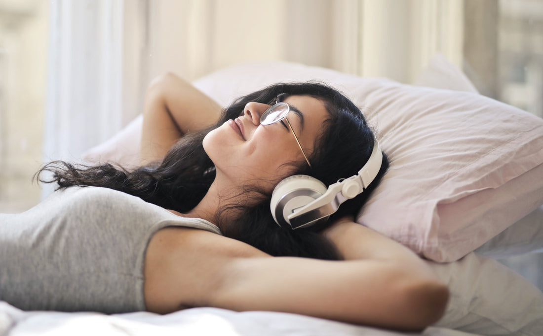 selfcare, meditation, relaxation, laying in bed, listening to music